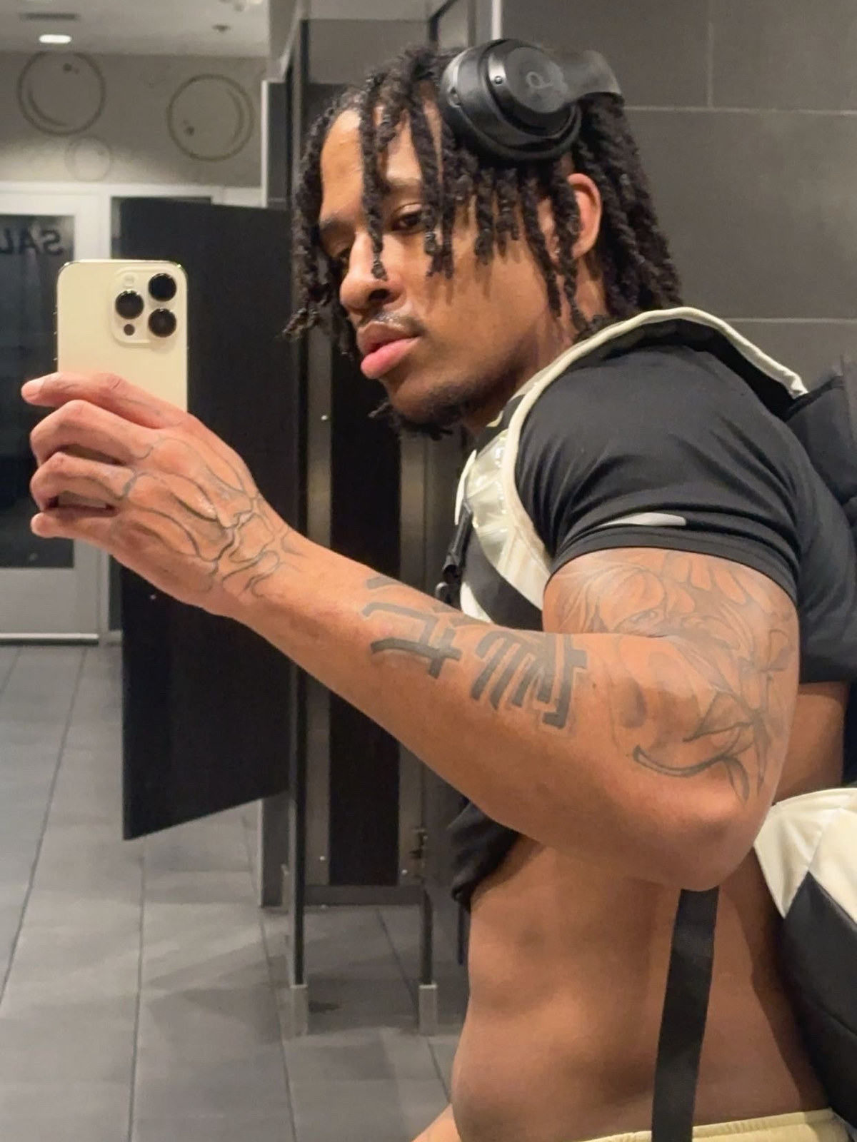 Before: Will from the side in a gym locker room